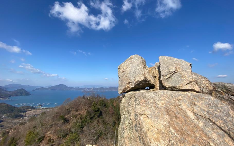 Giant rocks piled up at the summit of an island of the Seto Inland Sea